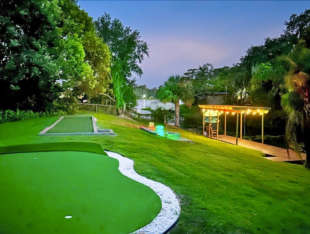 All the fun in one place: Putting green, bocce ball, fire pit, dock, and pergola.