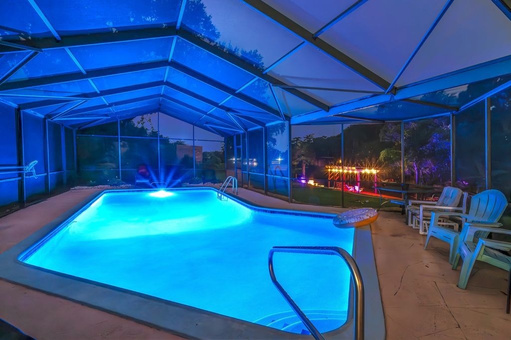 Evening swim vibes with pool lights.