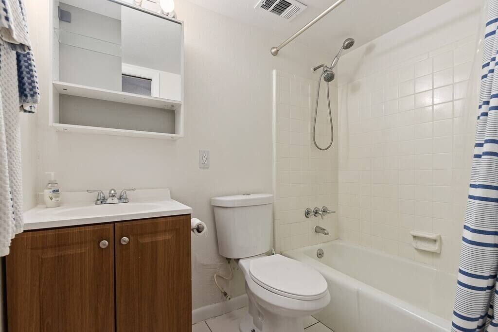 Downstairs bathroom attached to bedroom.