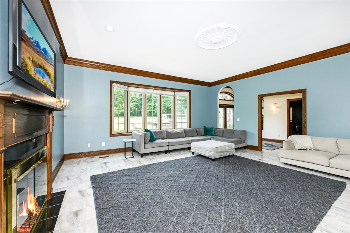 Curl up by the fireplace in the living room.