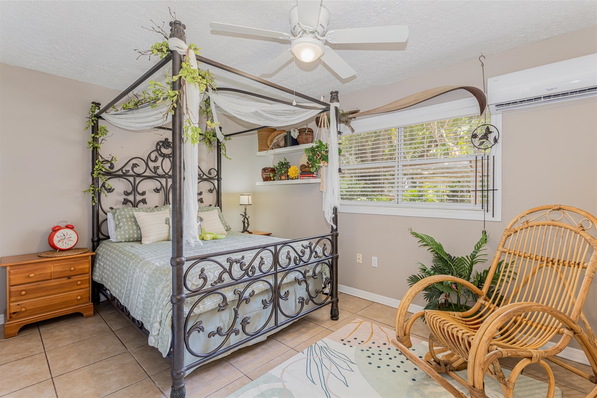 Queen-size bed located in the guest house.