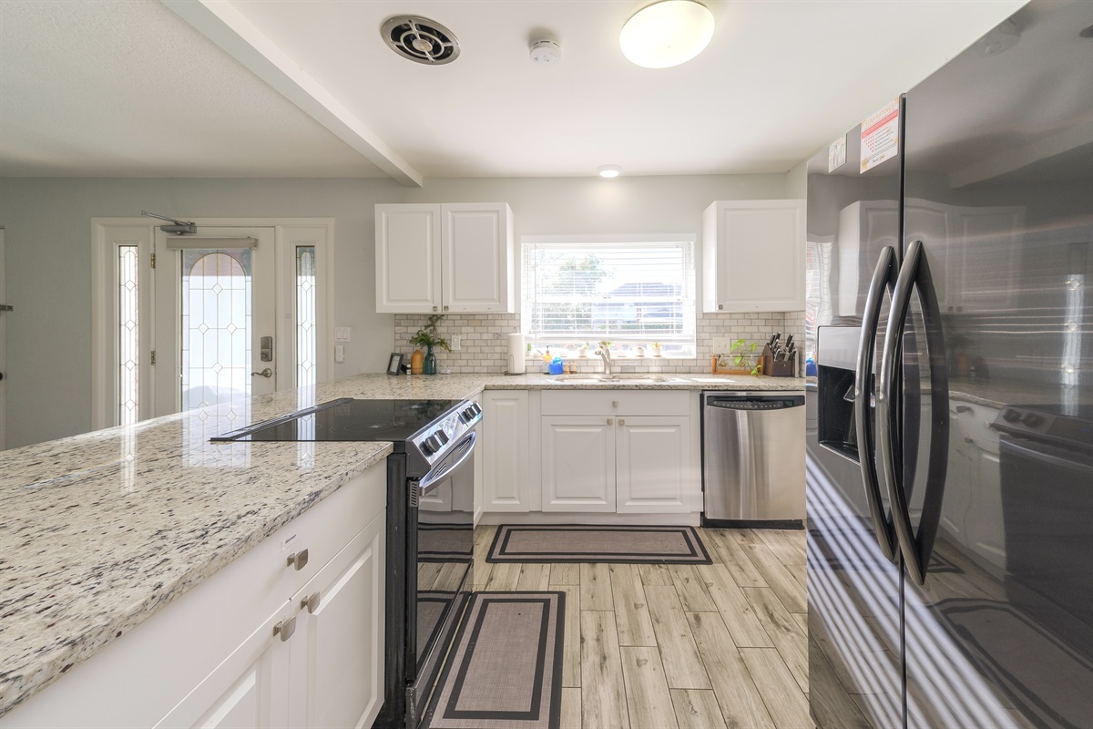 "The kitchen was completely equipped with modern cooktop, oven refrigerator, coffee makers, filters, dishes, flatware, wine glasses, utensils, pots and pans, soaps, plenty of extra towels." -