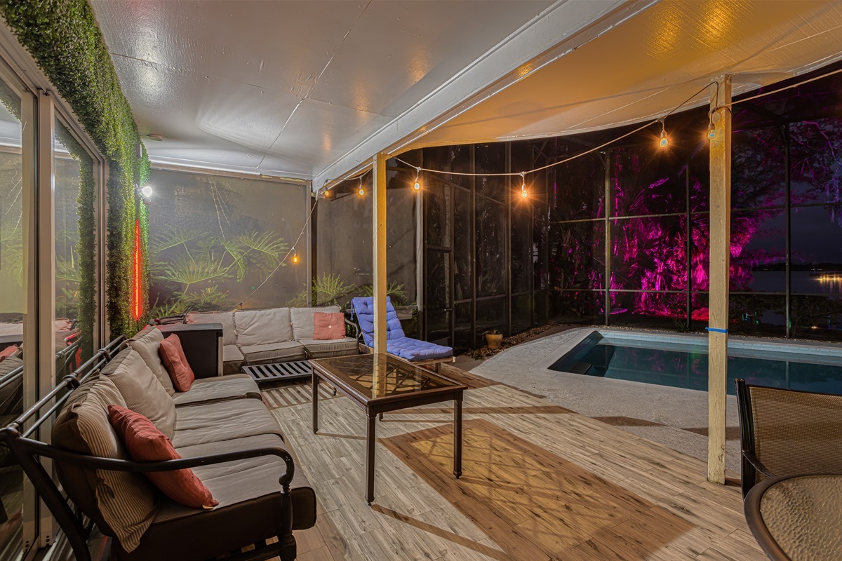 Snap a selfie by the grass wall while relaxing by the pool.