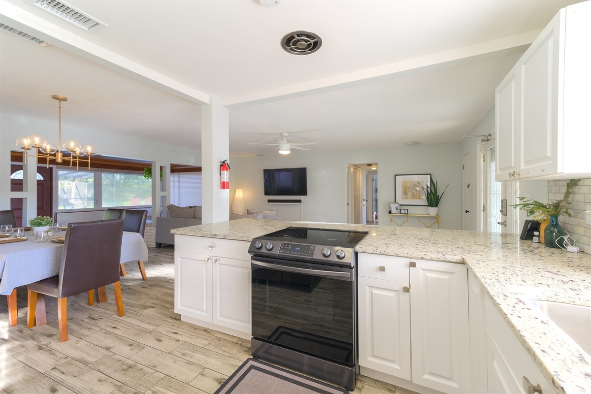 The open floor plan allows everyone to enjoy cooking and hanging out together.