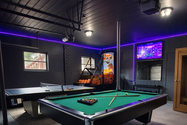 Game room featuring a pool table, ping pong table and arcade basketball