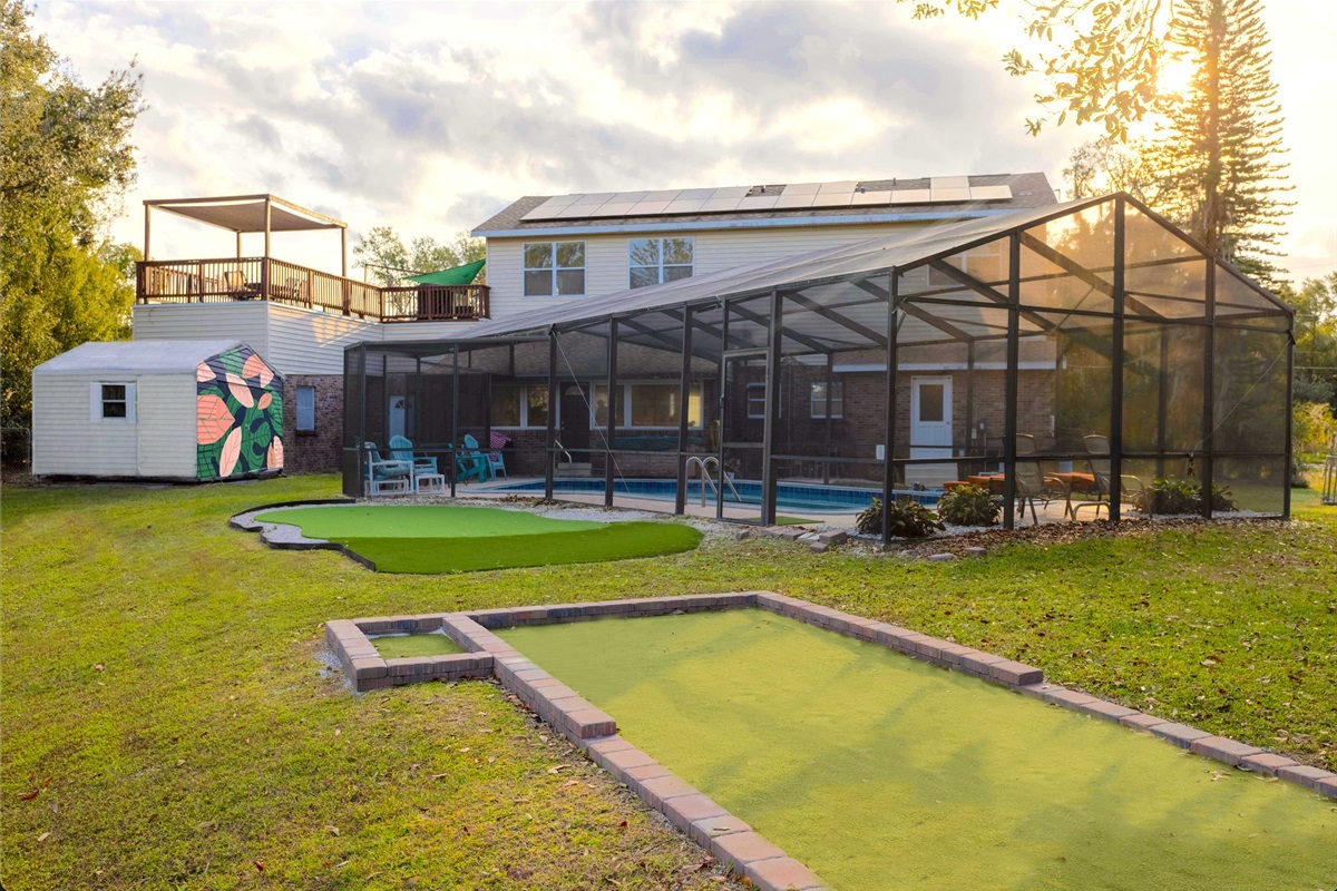 Shared putting green, bocce ball, fire pit, dock and pergola! Ultimate hang out spot.