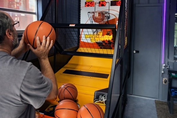Arcade basketball game inside the entertainment room.