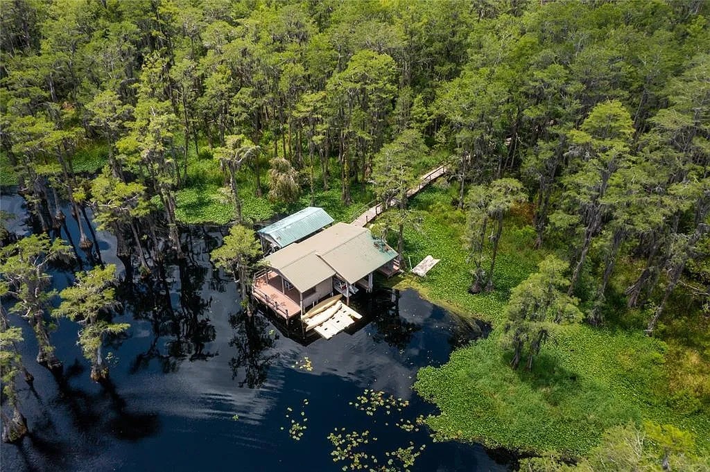 Scenic overhead shot of our lakeside retreat surrounded by nature