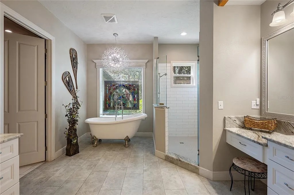 One of our elegant bathroom with a classic soaking tub.