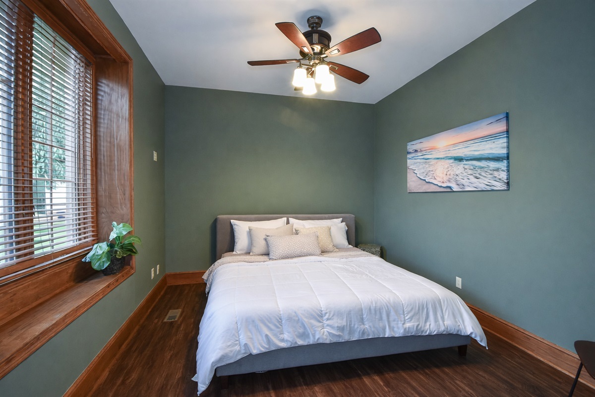 Downstairs guest room with queen-size bed.