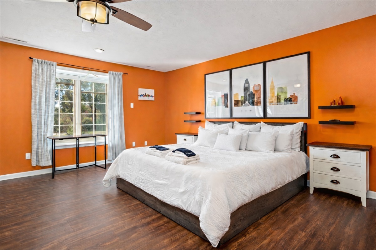 King size bed and custom mural in the "Cleveland Room"