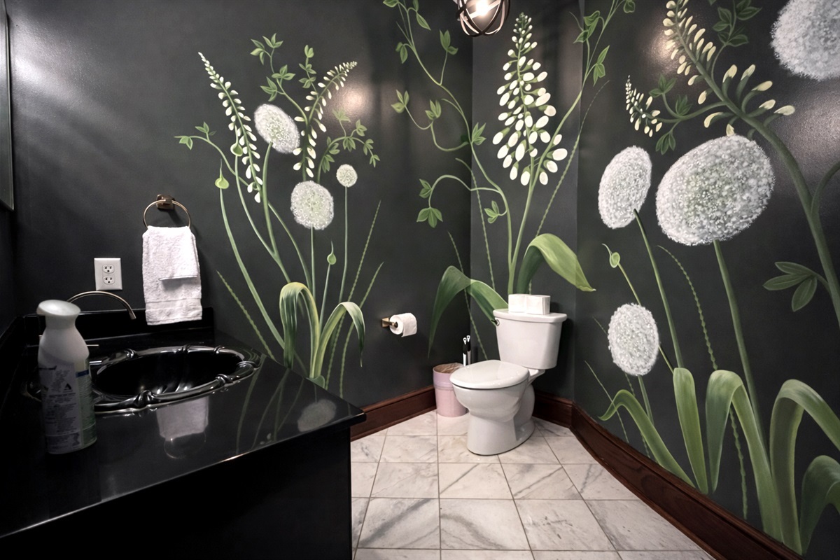 Our stylish event bathroom featuring hand painted floral murals.