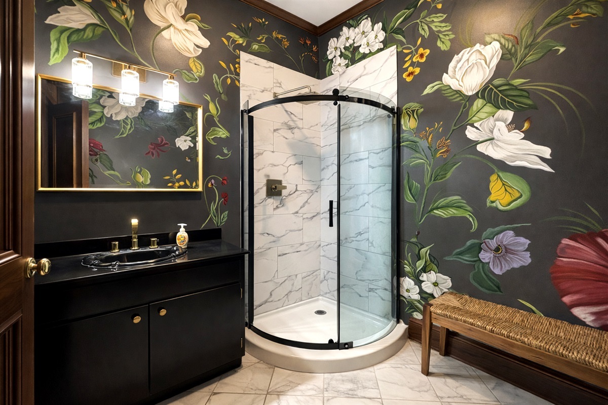 Our stylish event bathroom featuring hand painted floral murals.