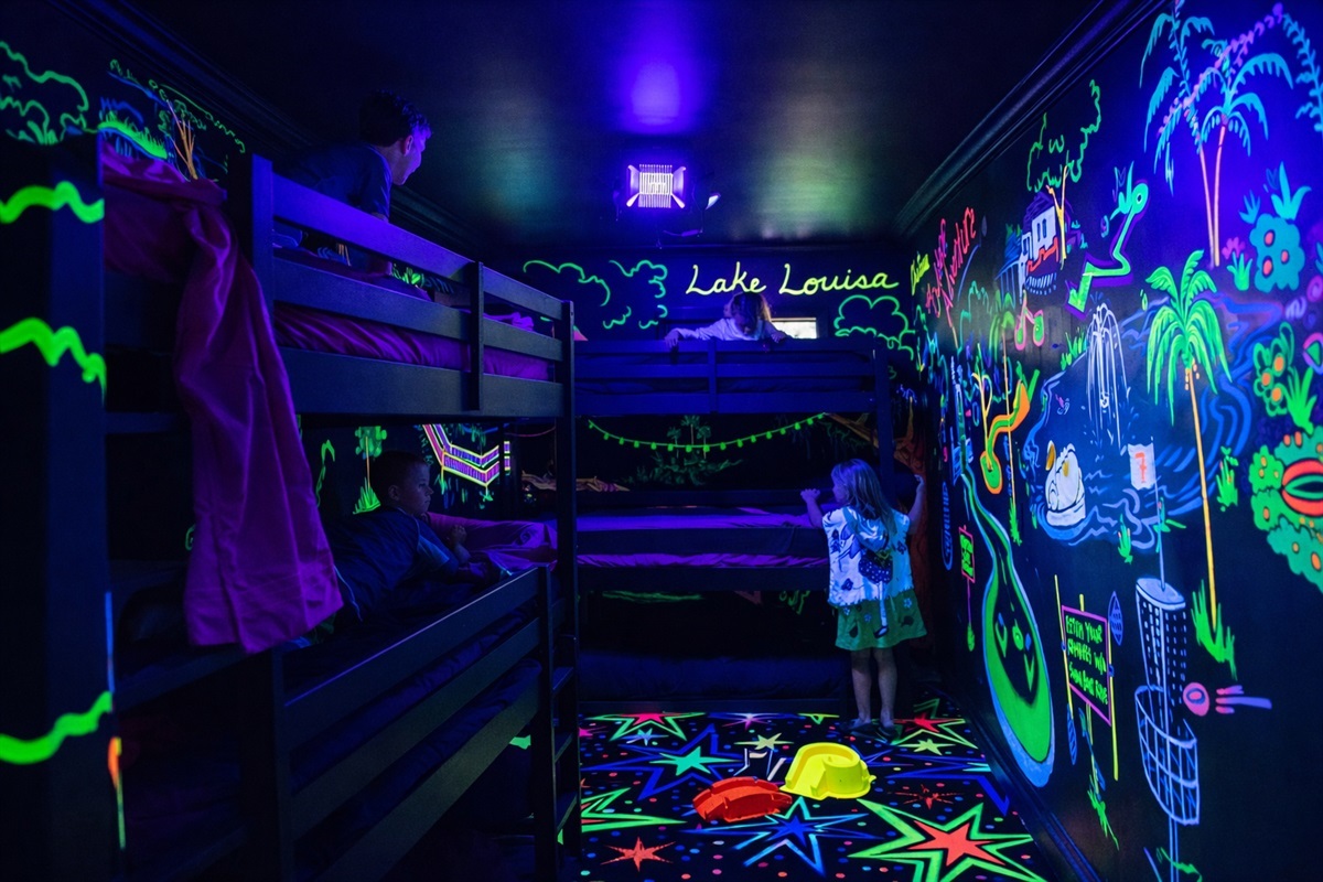 2 Triple bunk beds in the neon guest arcade guest house