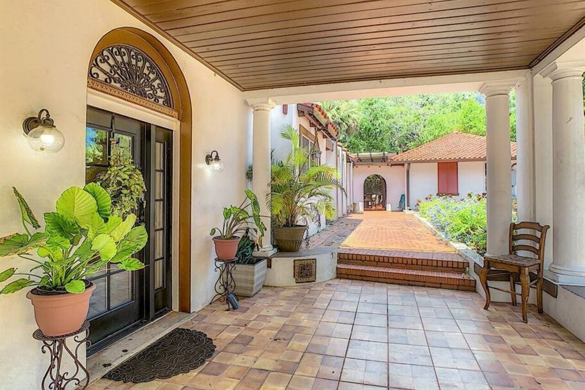 Step through the covered entrance into historic charm, great for weddings, events, and stays.