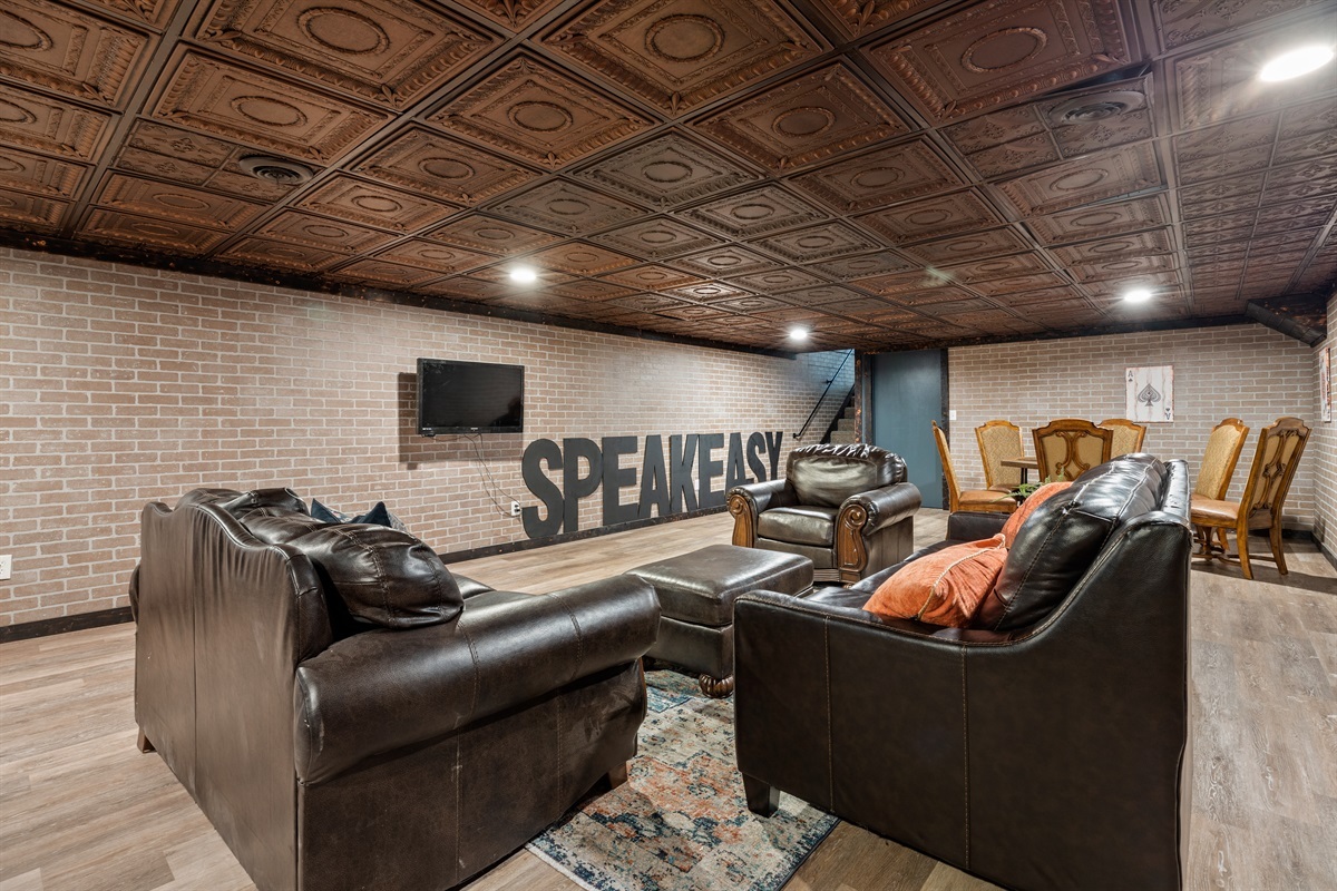 Relax in our Speakeasy Lounge &ndash; Cozy Seating & a Pull-Out Couch for additional sleeping space!