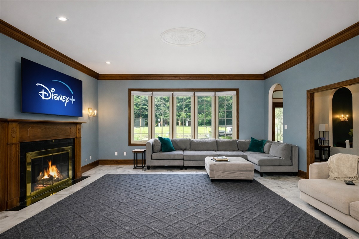 Curl up by the fireplace in the living room.