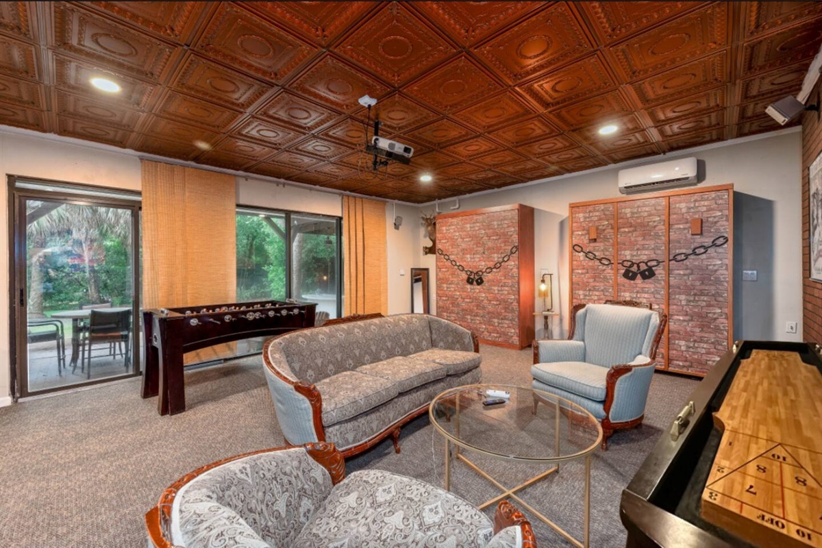 The Speakeasy features two queen Murphy beds and two queen blow-up beds for flexible sleeping space.