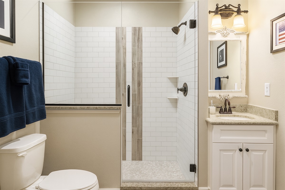 Beautifully tiled shower and vanity&mdash;simple and stylish