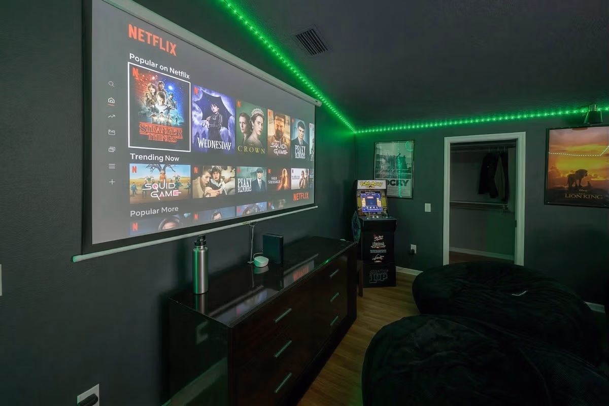 Game room with projection screen and green LED lighting in Blue Room at Clear Lake Casa, Florida