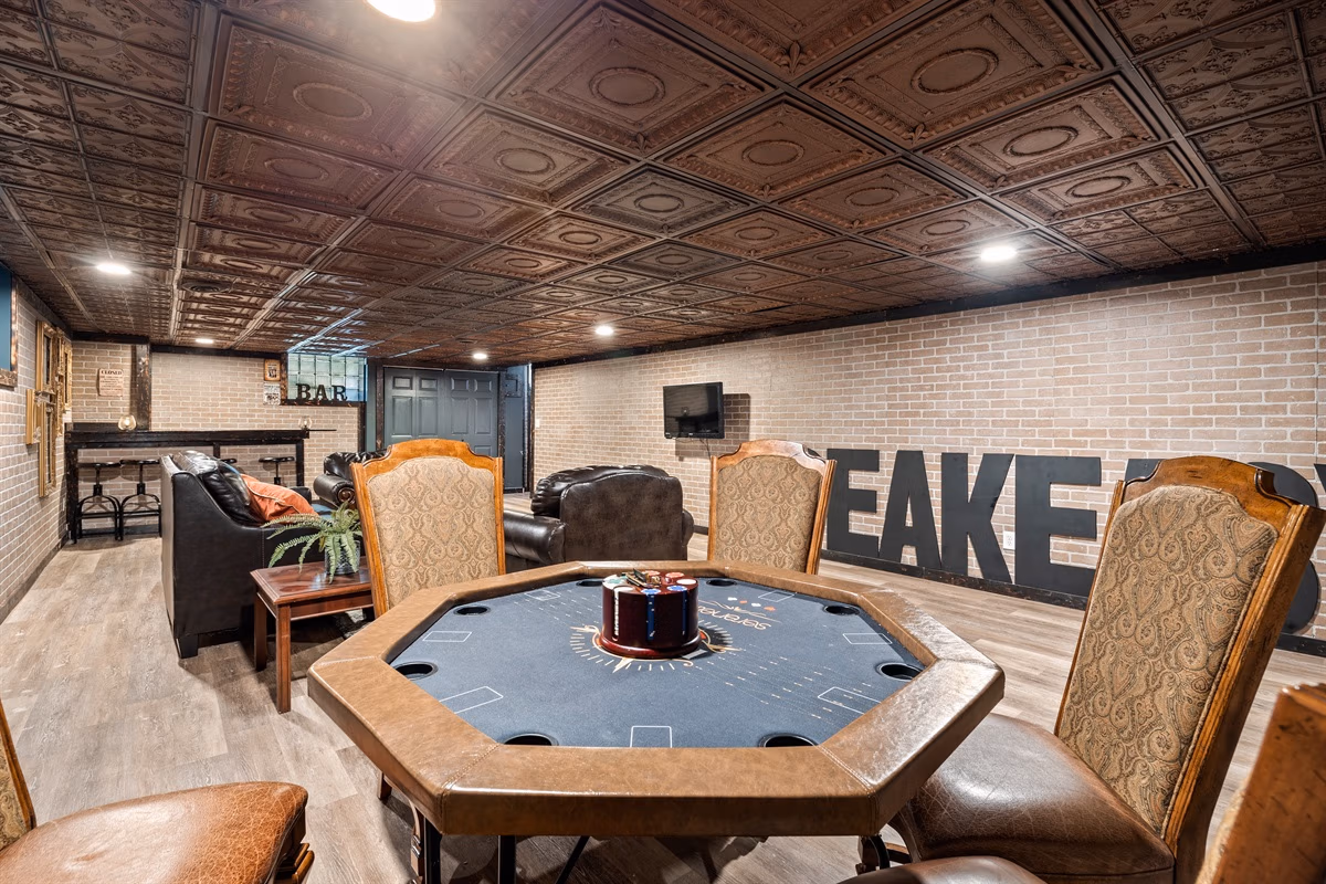 Rustic bar lounge with poker table and brick walls in Cleveland Room at Medina Mansion, Ohio